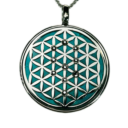 FIORE DELLA VITA, CIONDOLO CON SFONDO IN MADREPERLA NATURALE. GIOIELLO SPIRITUALE GEOMETRIE SACRE.